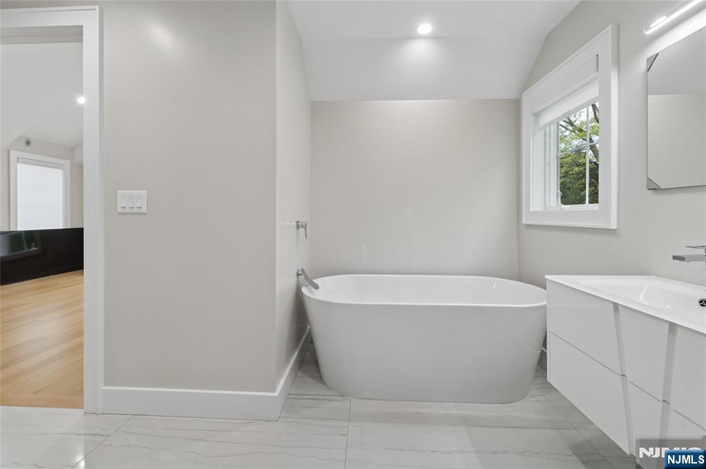 31 Engleside Street Cresskill, NJ 07626 - Photo 29 of 49 a bathroom with a bathtub and window