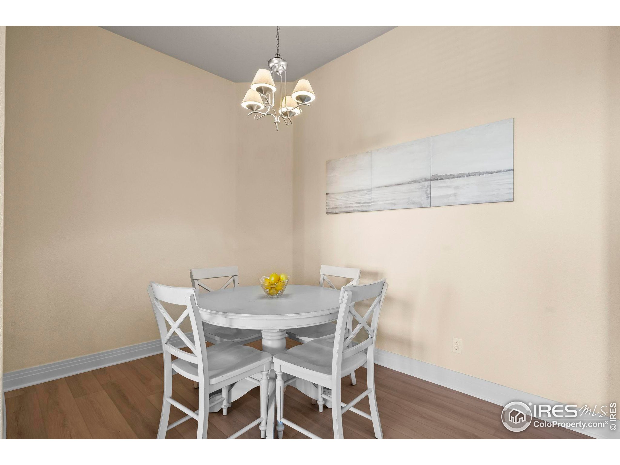 209 Quebec Street, Unit L Denver, CO 80220 - Photo 19 of 46 a view of a dining room with furniture and chandelier