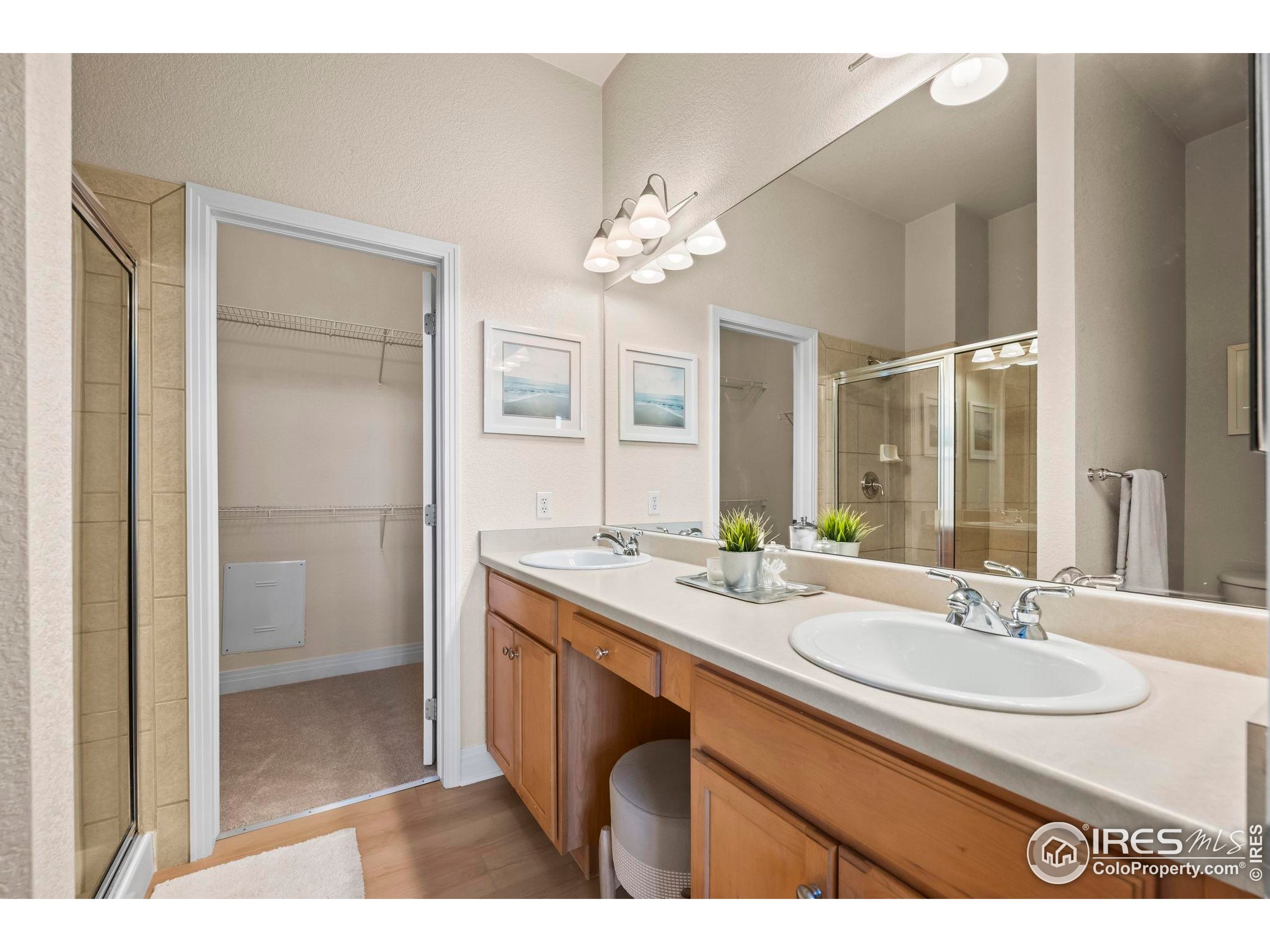 209 Quebec Street, Unit L Denver, CO 80220 - Photo 24 of 46 a bathroom with a sink double vanity granite tub and a mirror