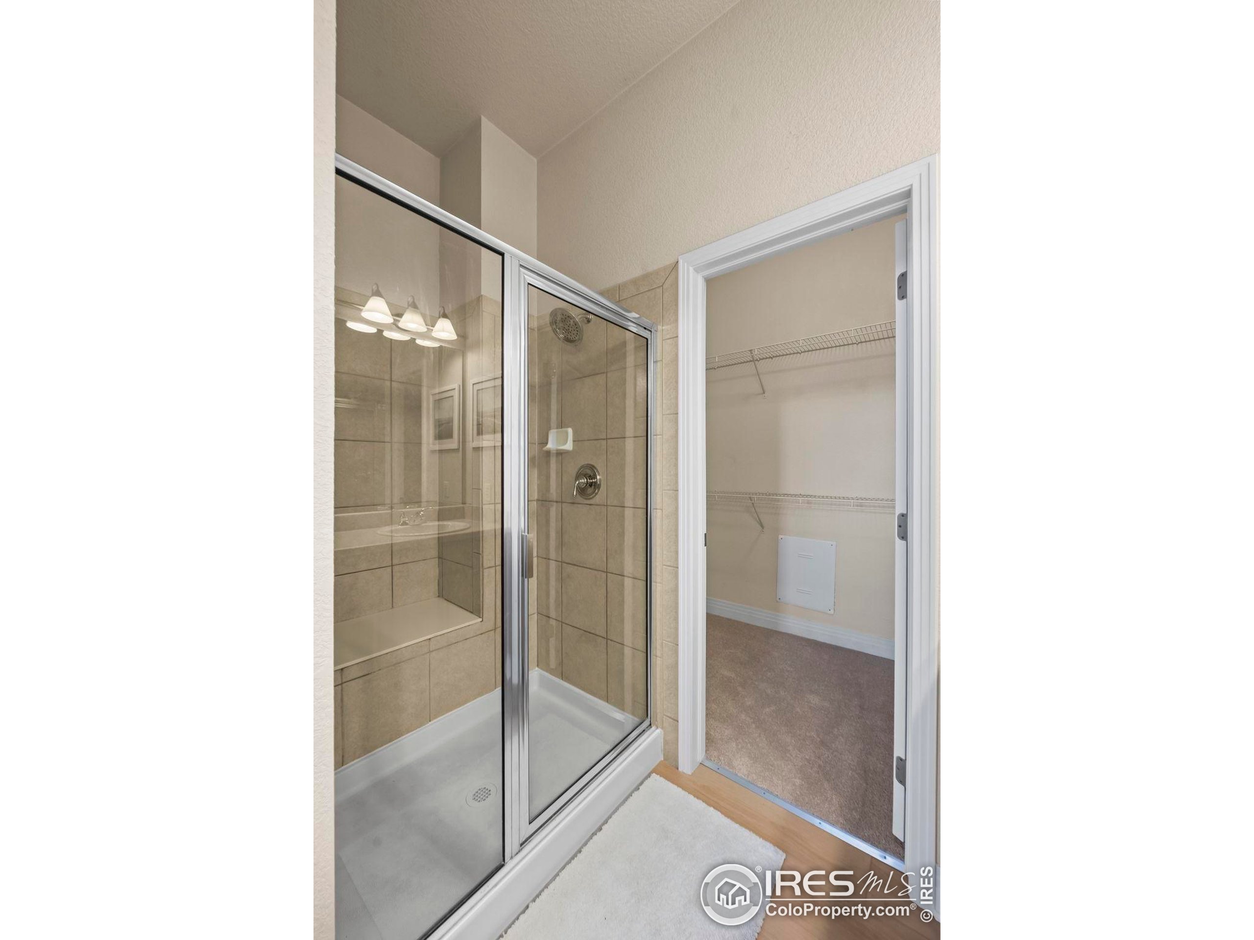 209 Quebec Street, Unit L Denver, CO 80220 - Photo 25 of 46 a bathroom with a glass shower door