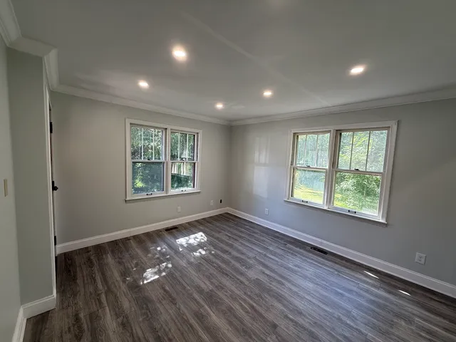 a bathroom with a double vanity sink toilet and shower