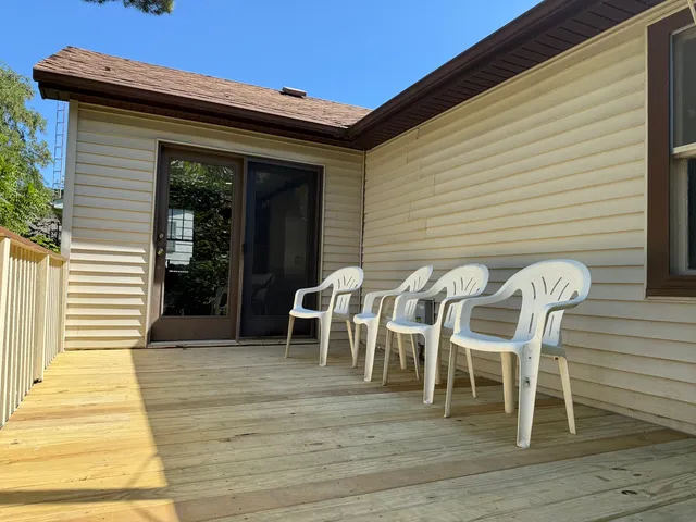 a patio with table and chairs