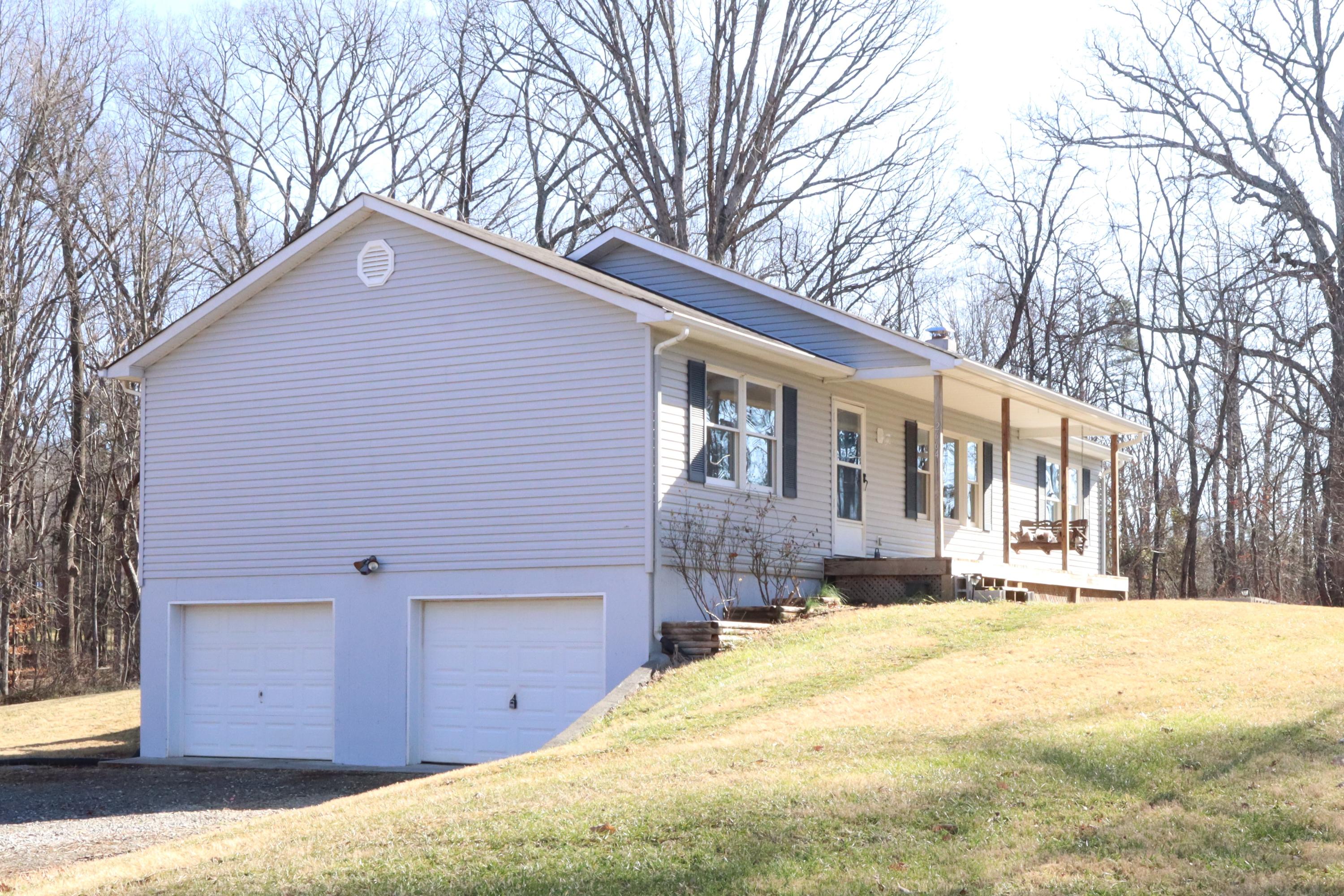 2664 Rutrough Road Southeast Roanoke, VA 24014 - Photo 1 of 19 a front view of house with yard and trees in the background