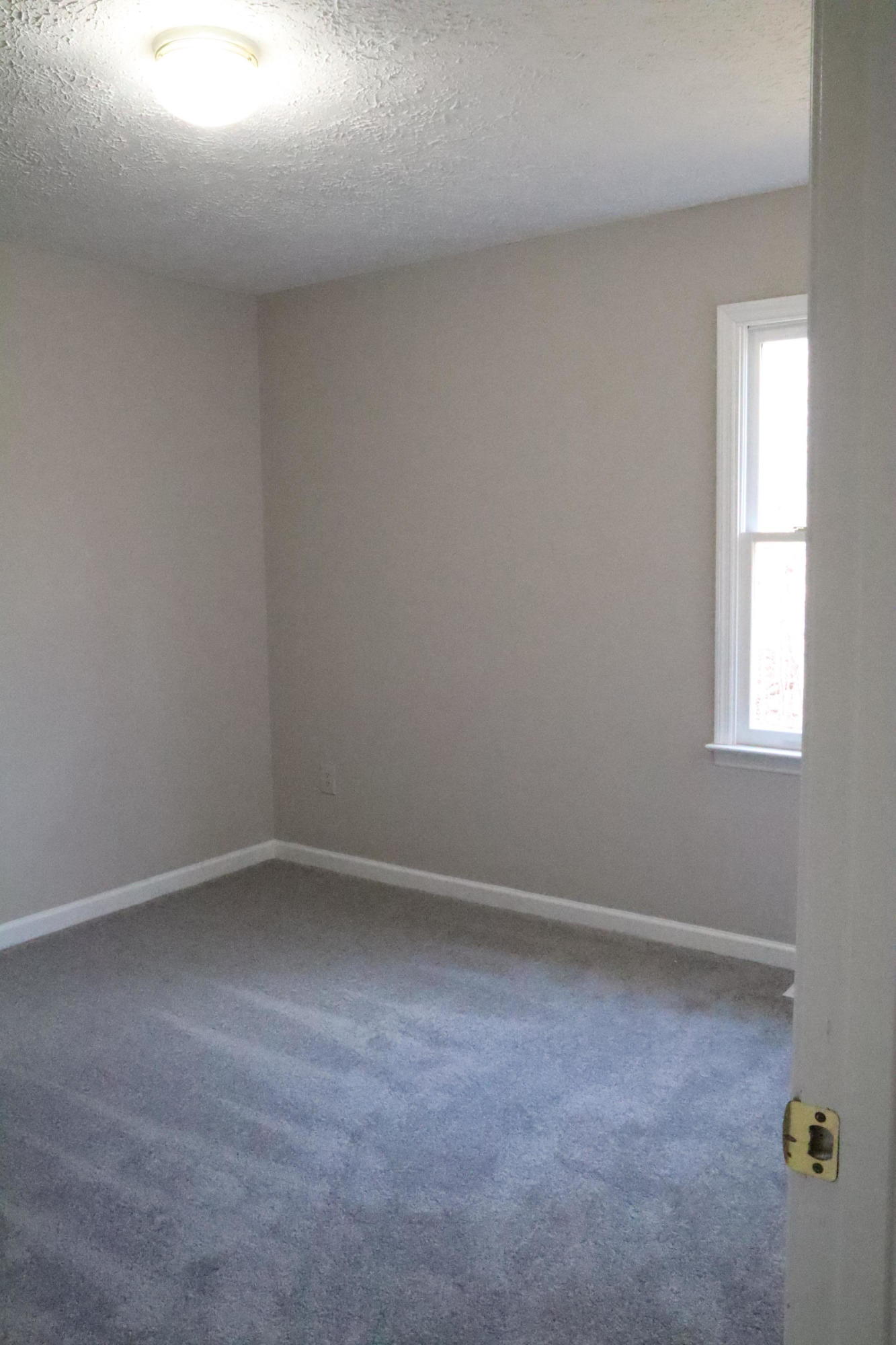 2664 Rutrough Road Southeast Roanoke, VA 24014 - Photo 11 of 19 an empty room with a window