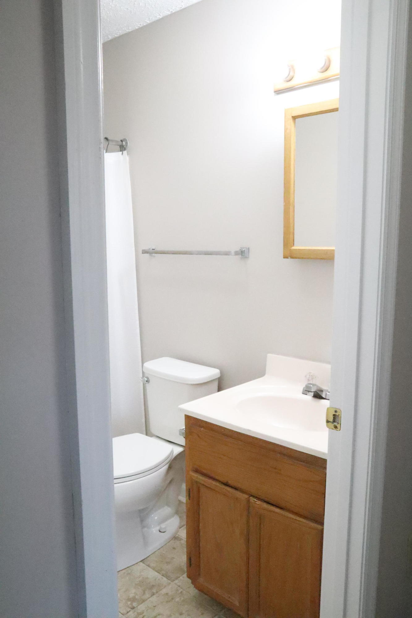 2664 Rutrough Road Southeast Roanoke, VA 24014 - Photo 13 of 19 a bathroom with a sink a toilet and a mirror