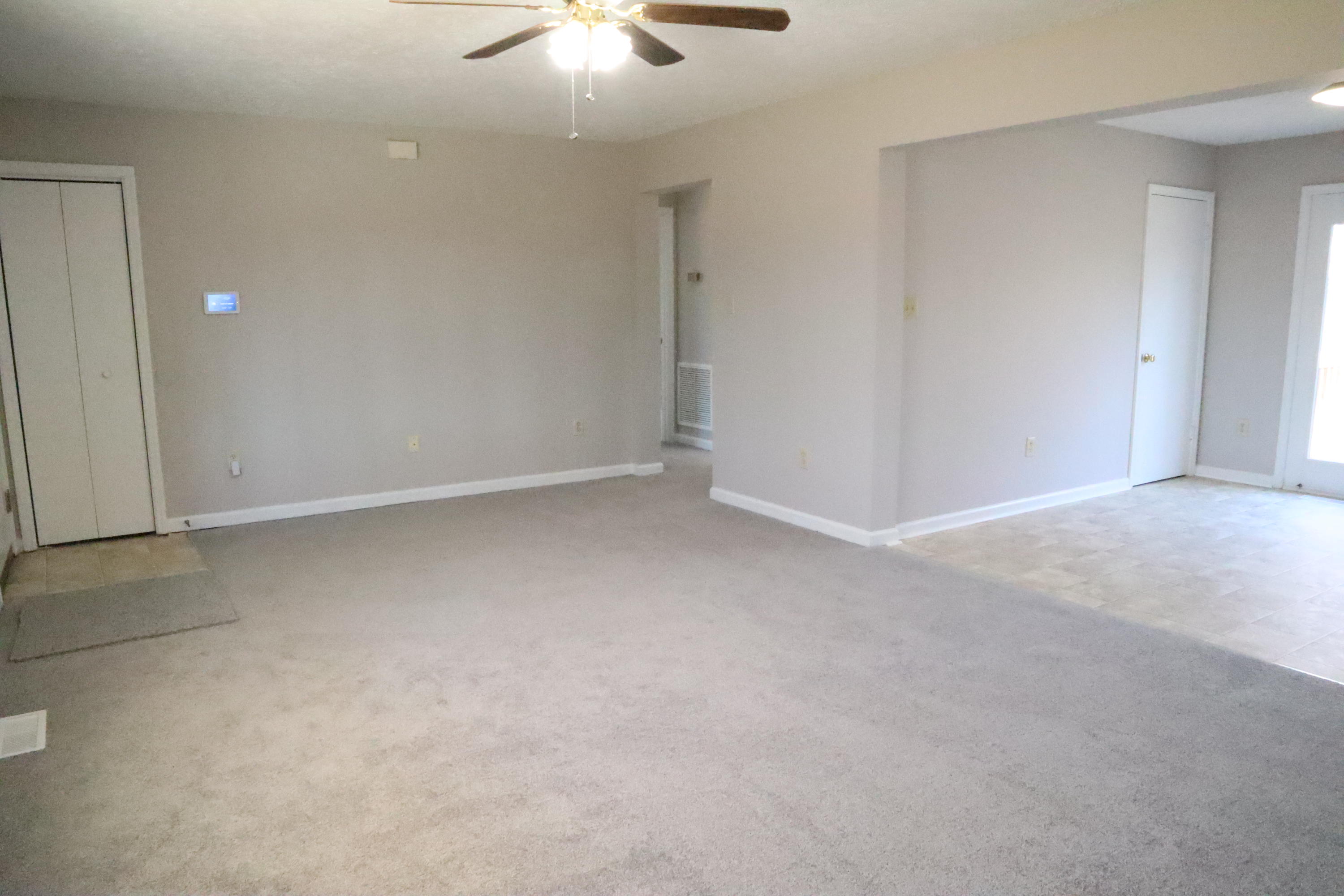 2664 Rutrough Road Southeast Roanoke, VA 24014 - Photo 4 of 19 an empty room with a chandelier fan