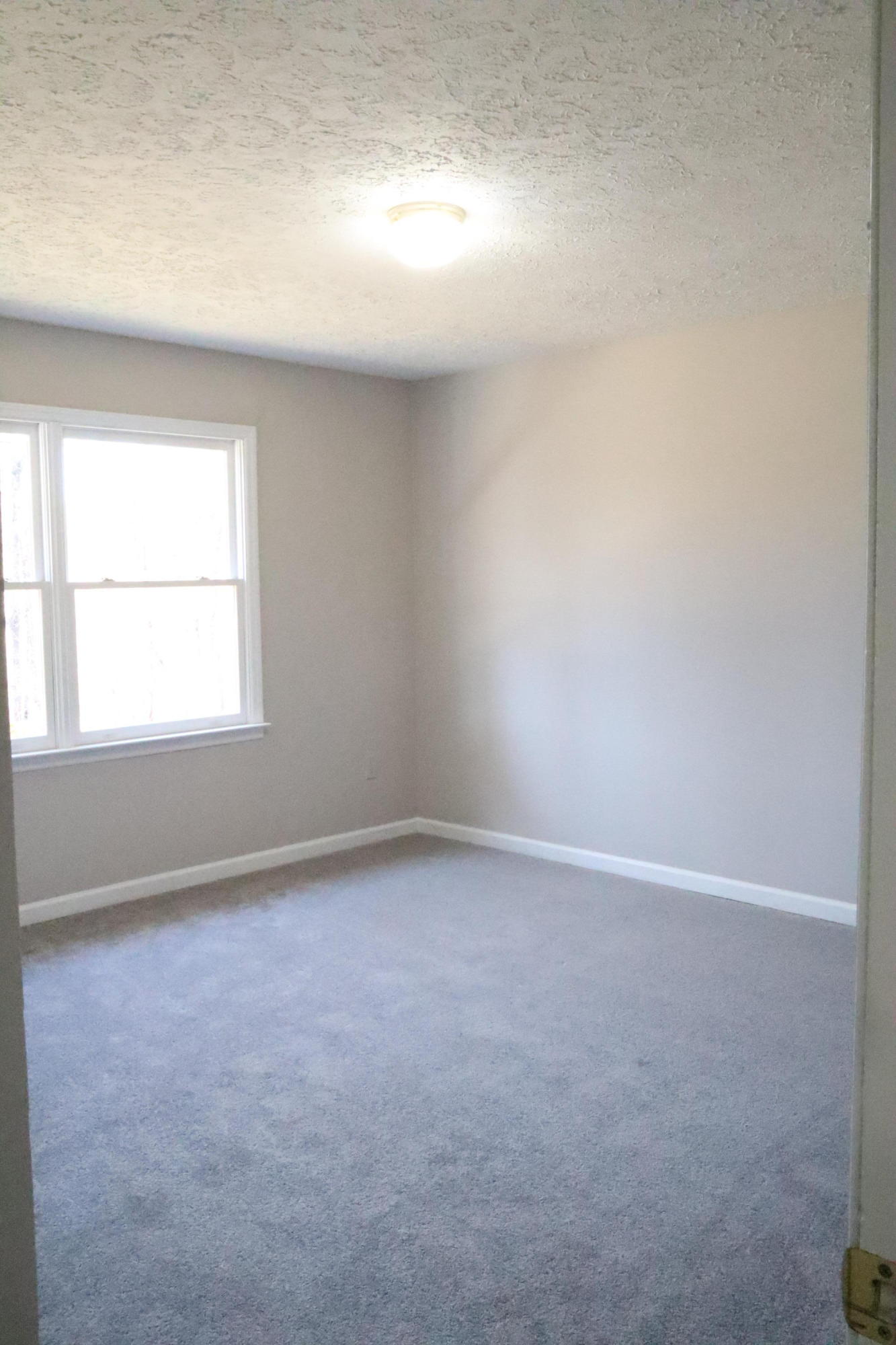 2664 Rutrough Road Southeast Roanoke, VA 24014 - Photo 10 of 19 an empty room with a window