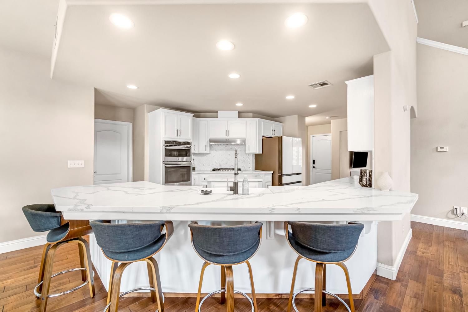 12 Breeze Way Madera, CA 93637 - Photo 11 of 56 a view of a dining room with furniture and wooden floor
