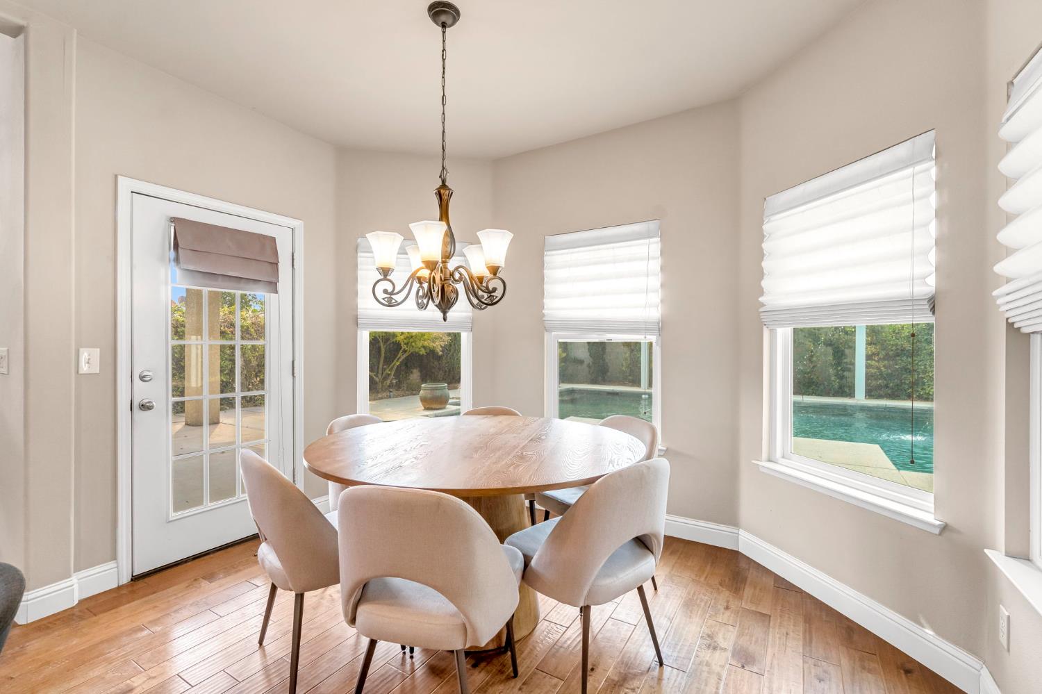 12 Breeze Way Madera, CA 93637 - Photo 14 of 56 a view of a dining room with furniture window and wooden floor
