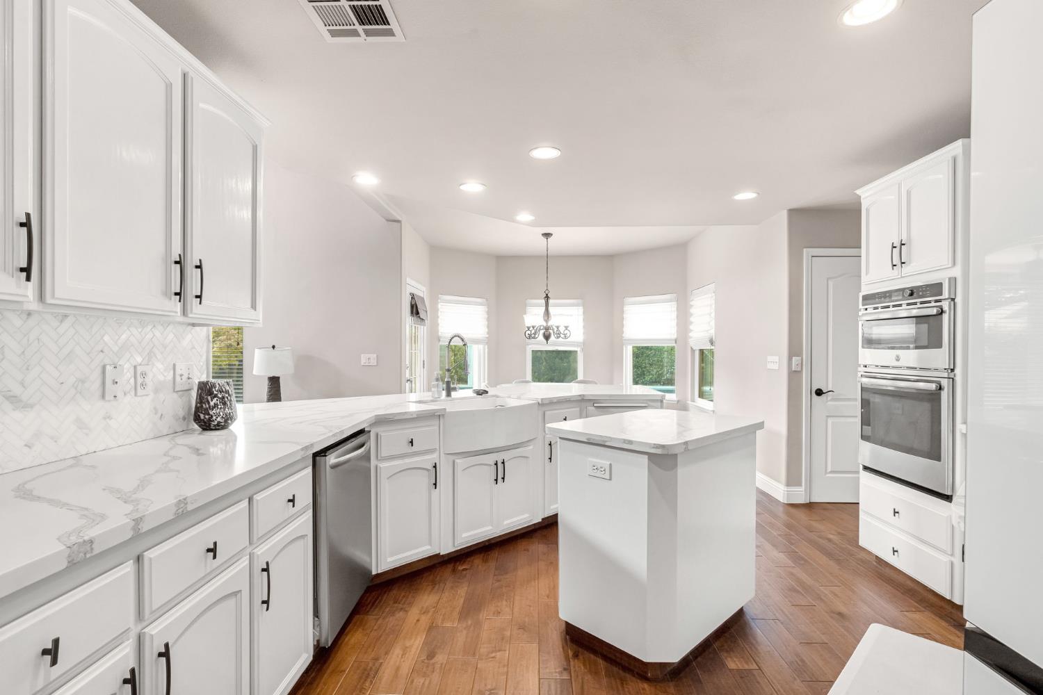12 Breeze Way Madera, CA 93637 - Photo 17 of 56 a kitchen with counter top space sink stainless steel appliances and cabinets