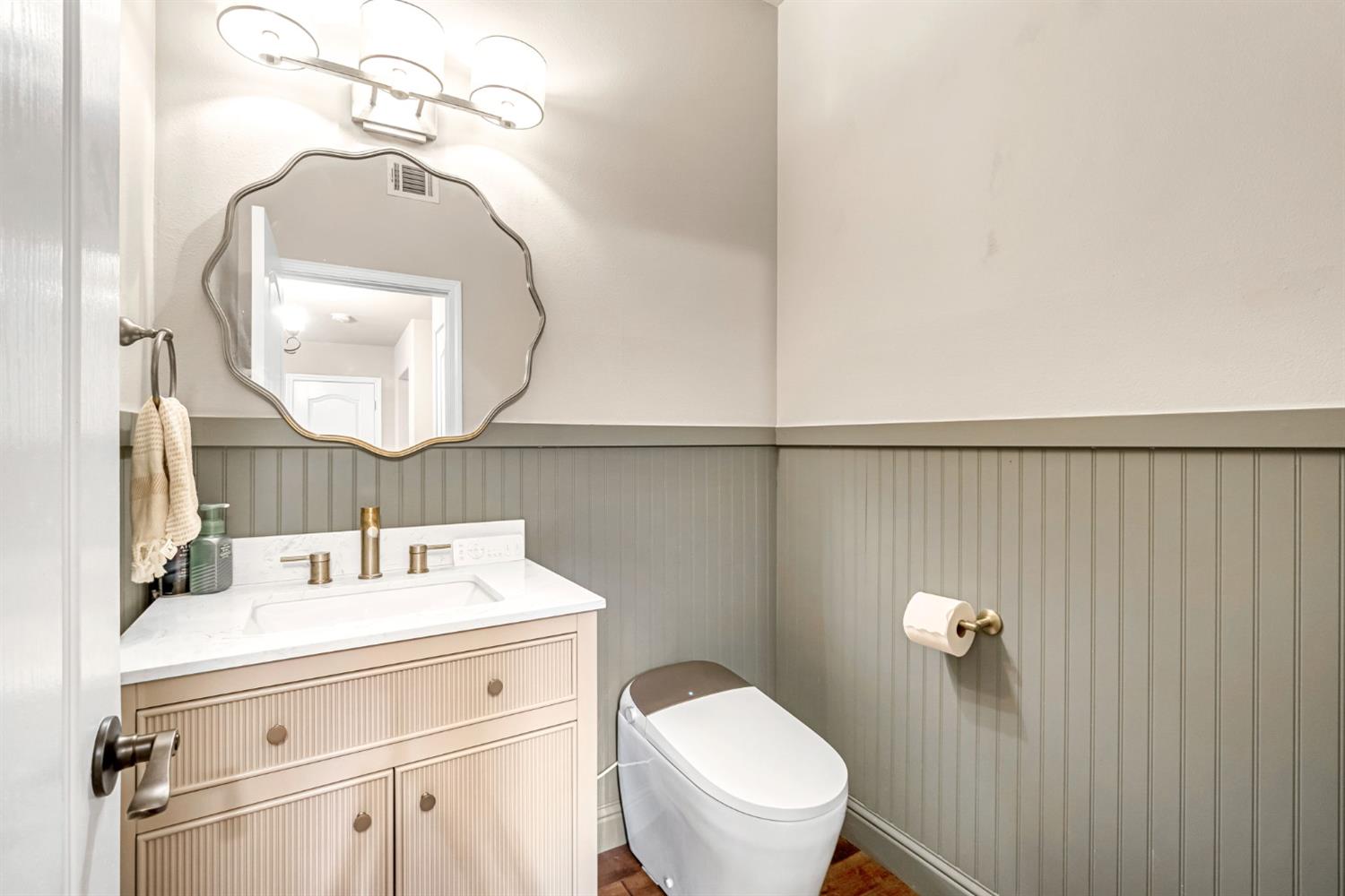 12 Breeze Way Madera, CA 93637 - Photo 21 of 56 a bathroom with a sink a mirror and toilet