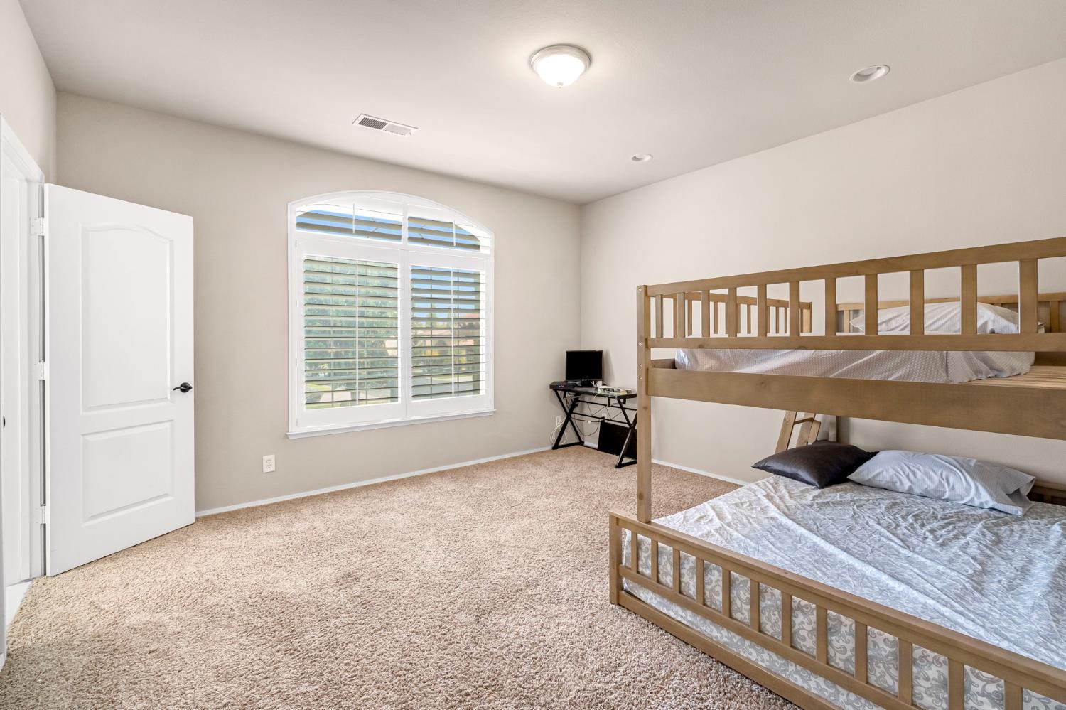 12 Breeze Way Madera, CA 93637 - Photo 27 of 56 a bedroom with furniture and a window