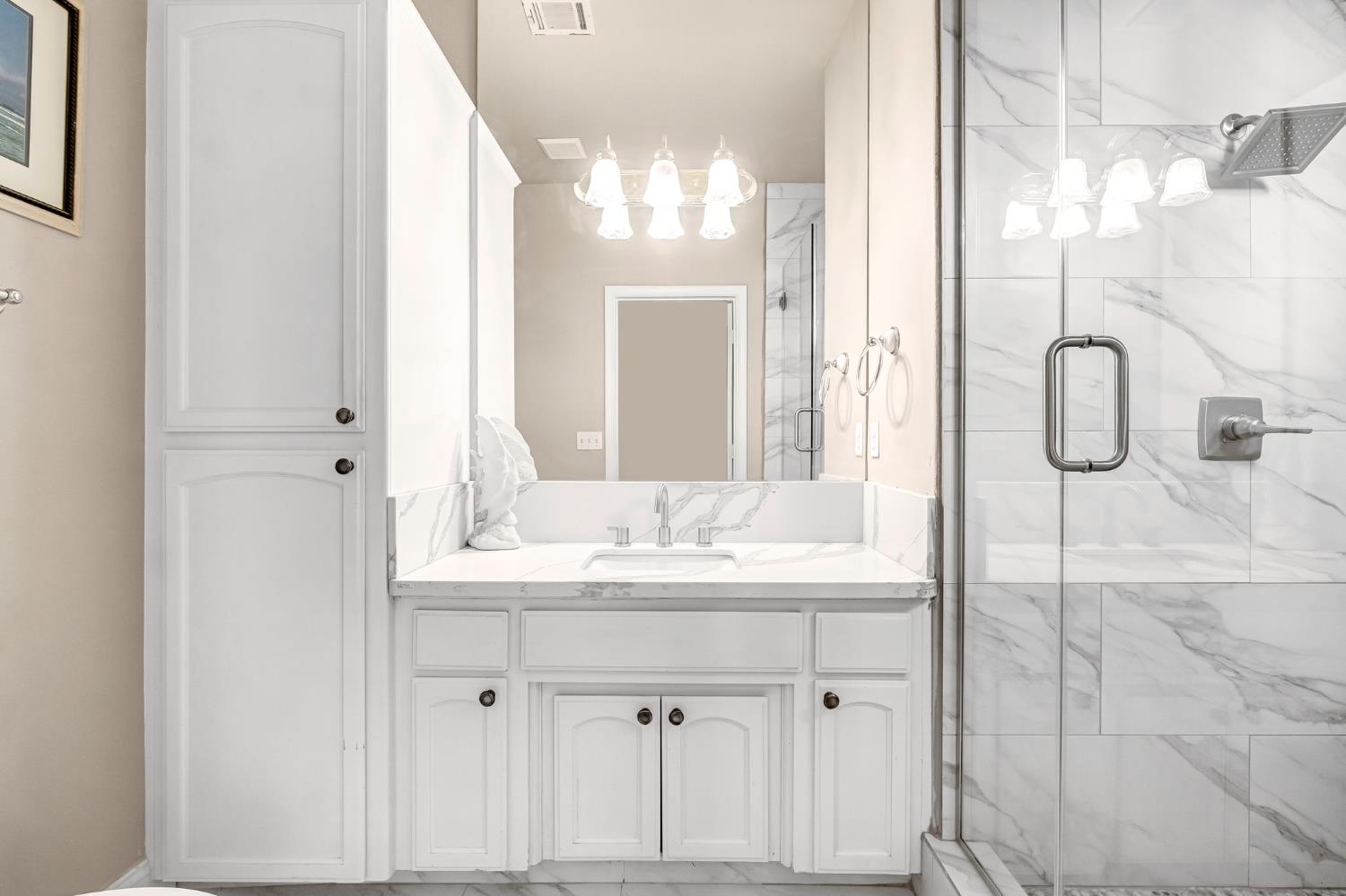 12 Breeze Way Madera, CA 93637 - Photo 29 of 56 a bathroom with a sink vanity and a mirror