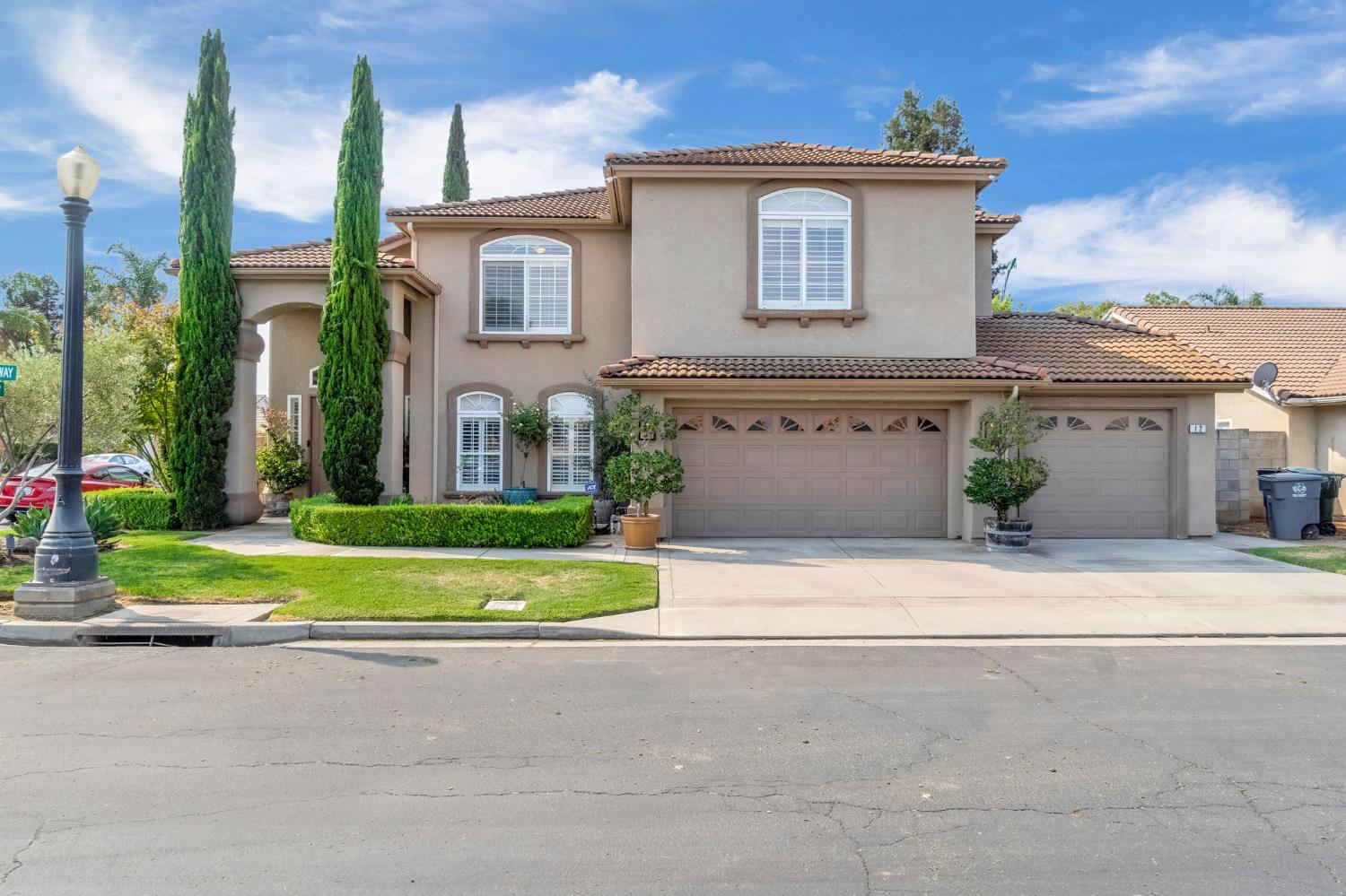 12 Breeze Way Madera, CA 93637 - Photo 4 of 56 a front view of a house with a yard and garage