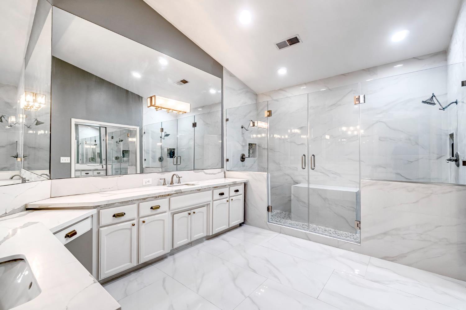 12 Breeze Way Madera, CA 93637 - Photo 41 of 56 a large bathroom with a large mirror vanity and a shower