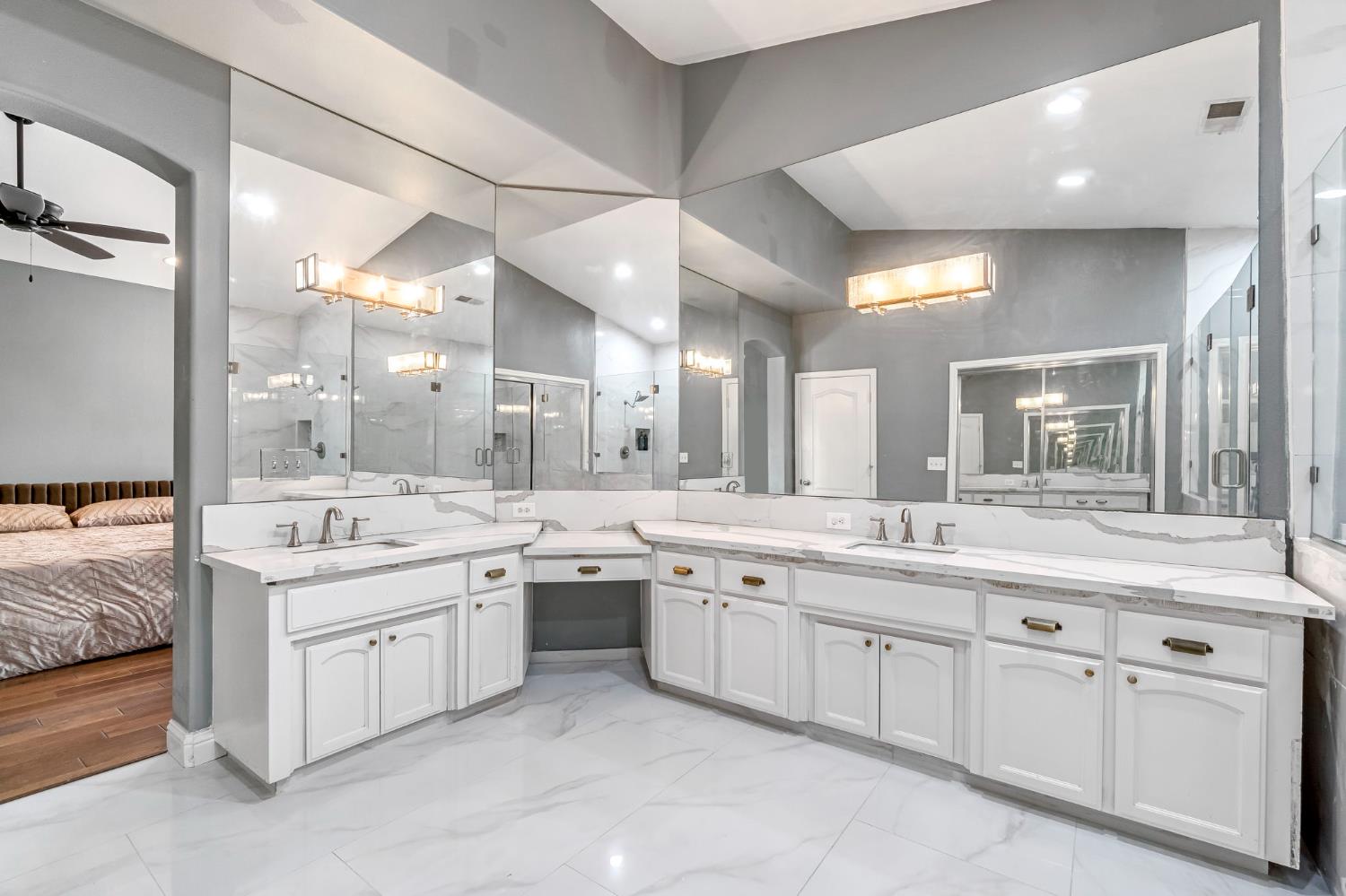 12 Breeze Way Madera, CA 93637 - Photo 42 of 56 a large white kitchen with a sink and dishwasher with white cabinets
