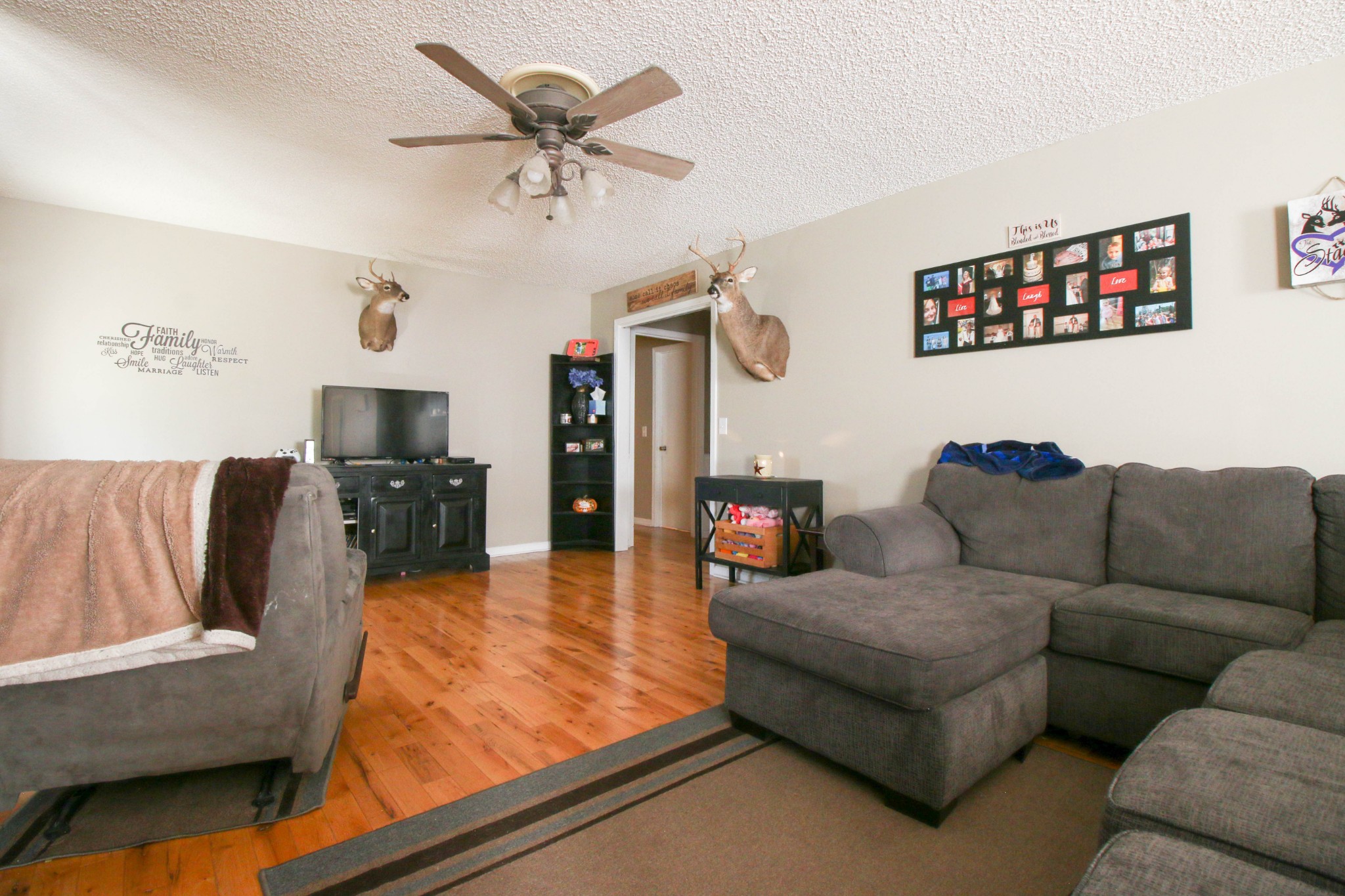 197 South Leath Road Portland, TN 37148 - Photo 8 of 14 a living room with furniture and a flat screen tv