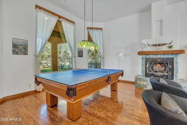 a living room with fireplace furniture and a flat screen tv
