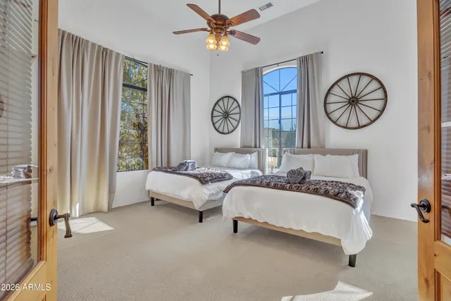 a bedroom with a bed and window