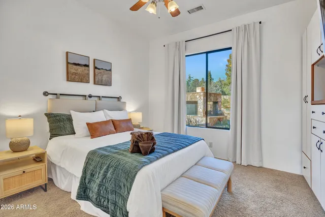 a front view of a house with outdoor seating