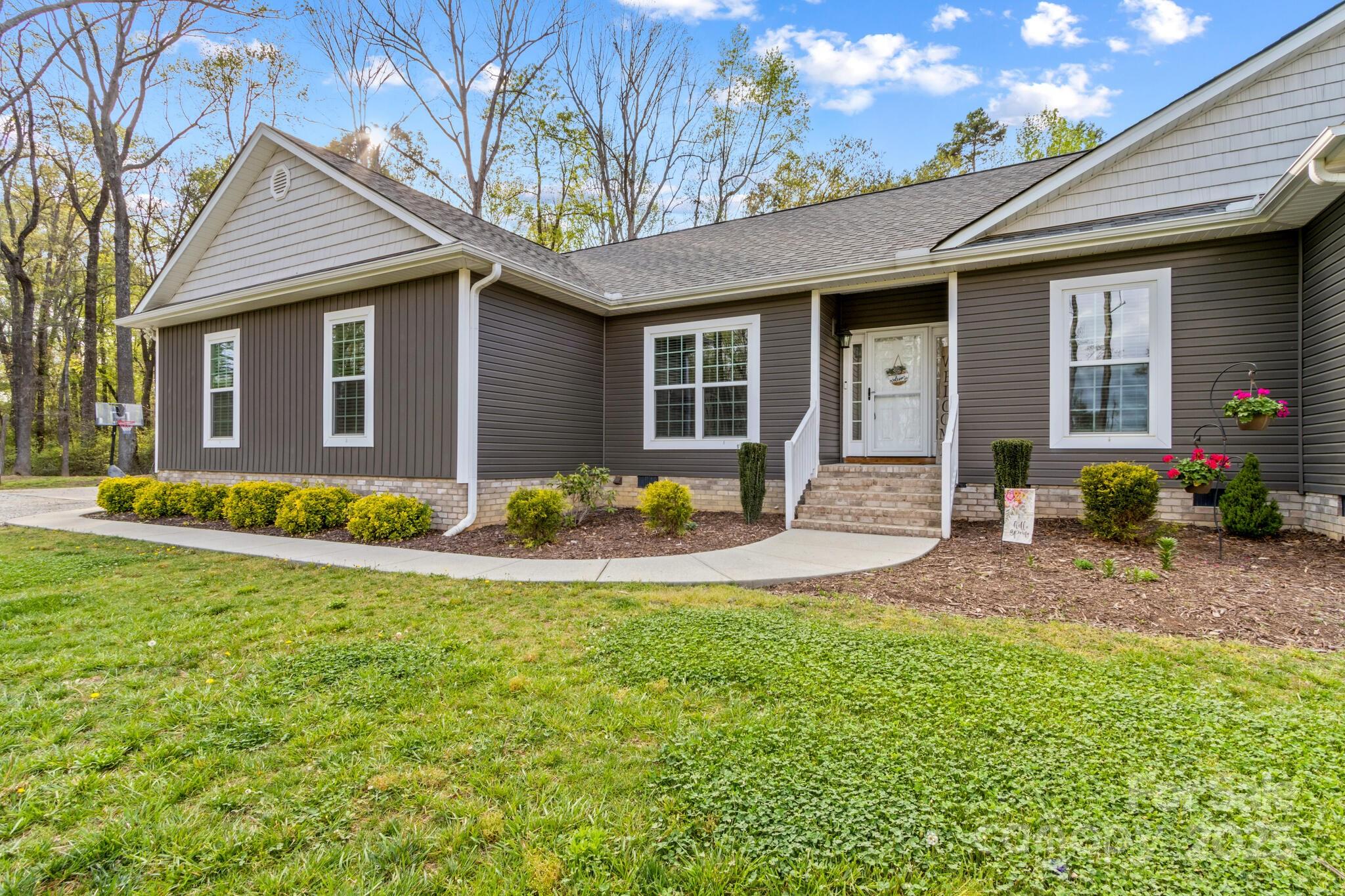 9060 Castor Road Salisbury, NC 28146 - Photo 3 of 47 a view of a house with a patio