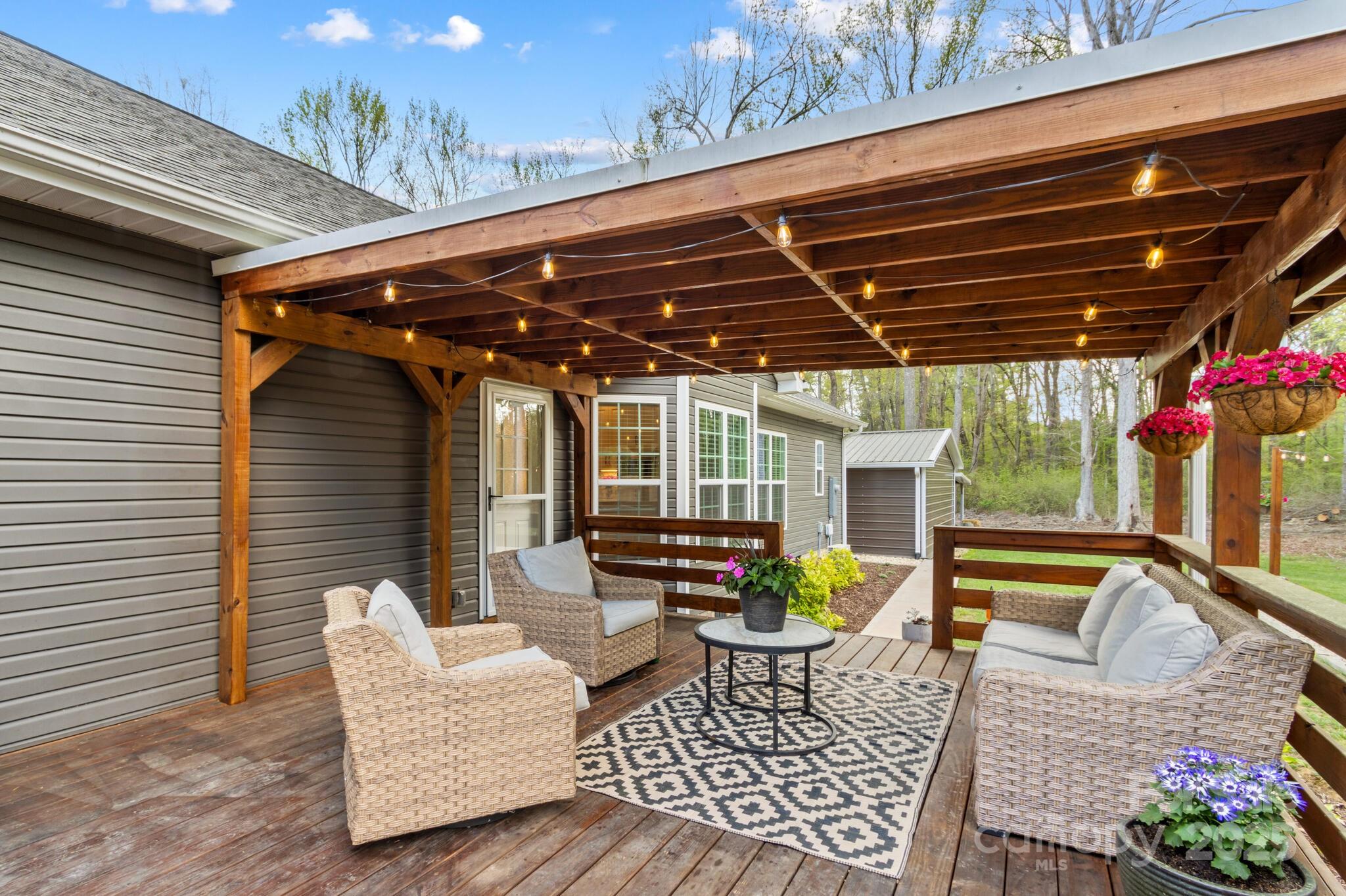 9060 Castor Road Salisbury, NC 28146 - Photo 39 of 47 a view of a chairs and table in the patio