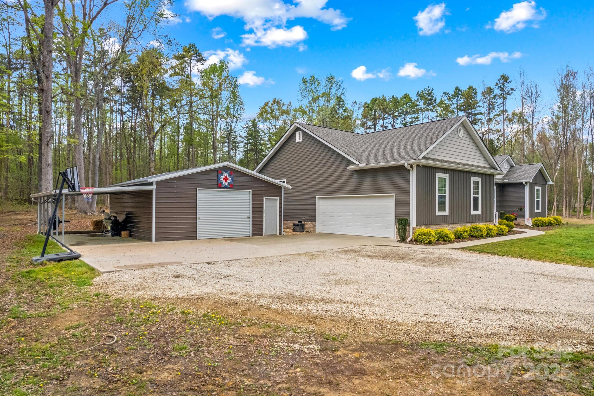 9060 Castor Road Salisbury, NC 28146 - Photo 4 of 47 a front view of a house with a yard and garage