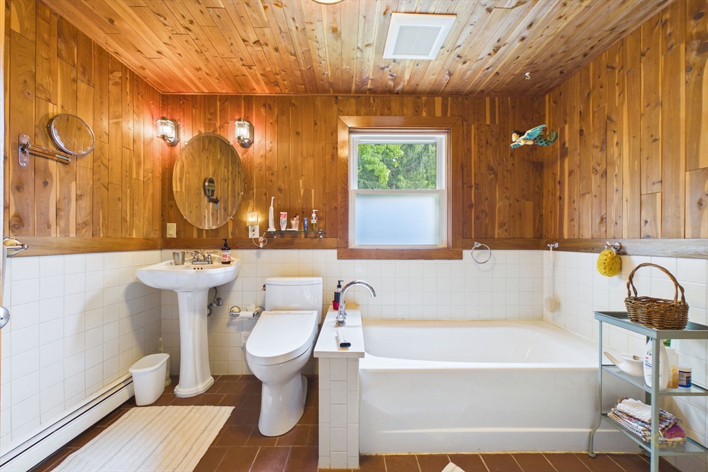70 Neponset Street Canton, MA 02021 - Photo 29 of 39 a bathroom with a sink a toilet and a bathtub