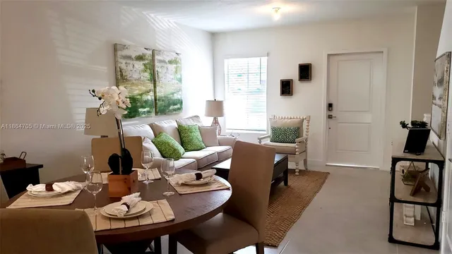 a living room with furniture and a table