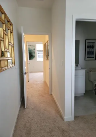 a view of hallway with livingroom