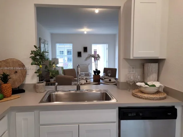 a kitchen with a sink and cabinets