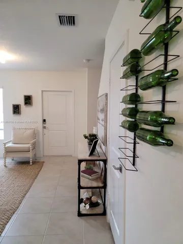 a bedroom with furniture and a potted plant