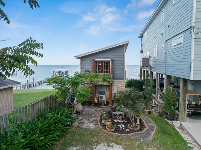 a view of a house with a yard and tree s