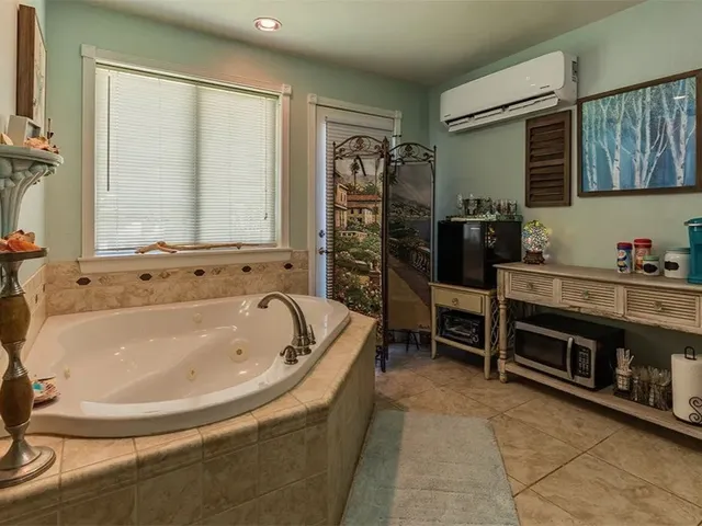 a bathroom with a toilet a sink and a mirror