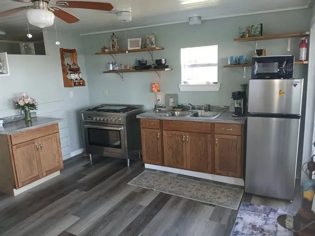 a large bed sitting in a bedroom next to a lamp