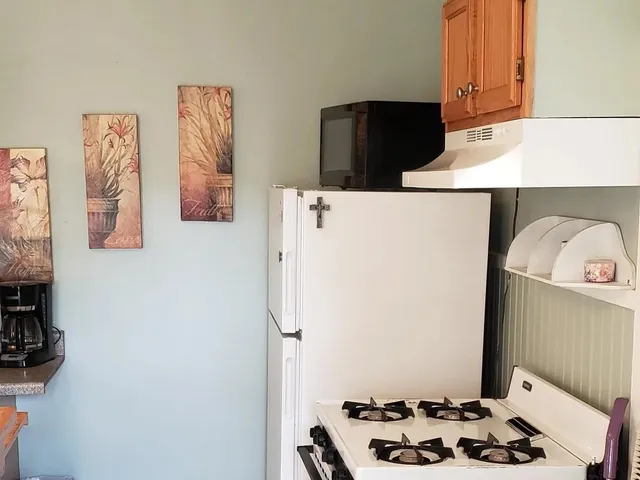 a room with table and chairs