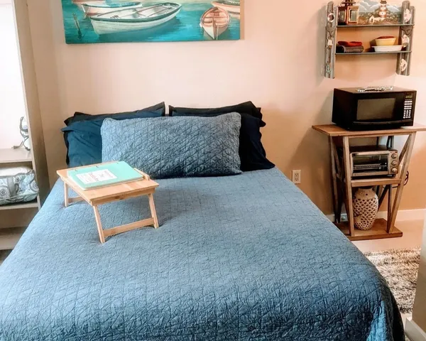 a living room with furniture and a lamp