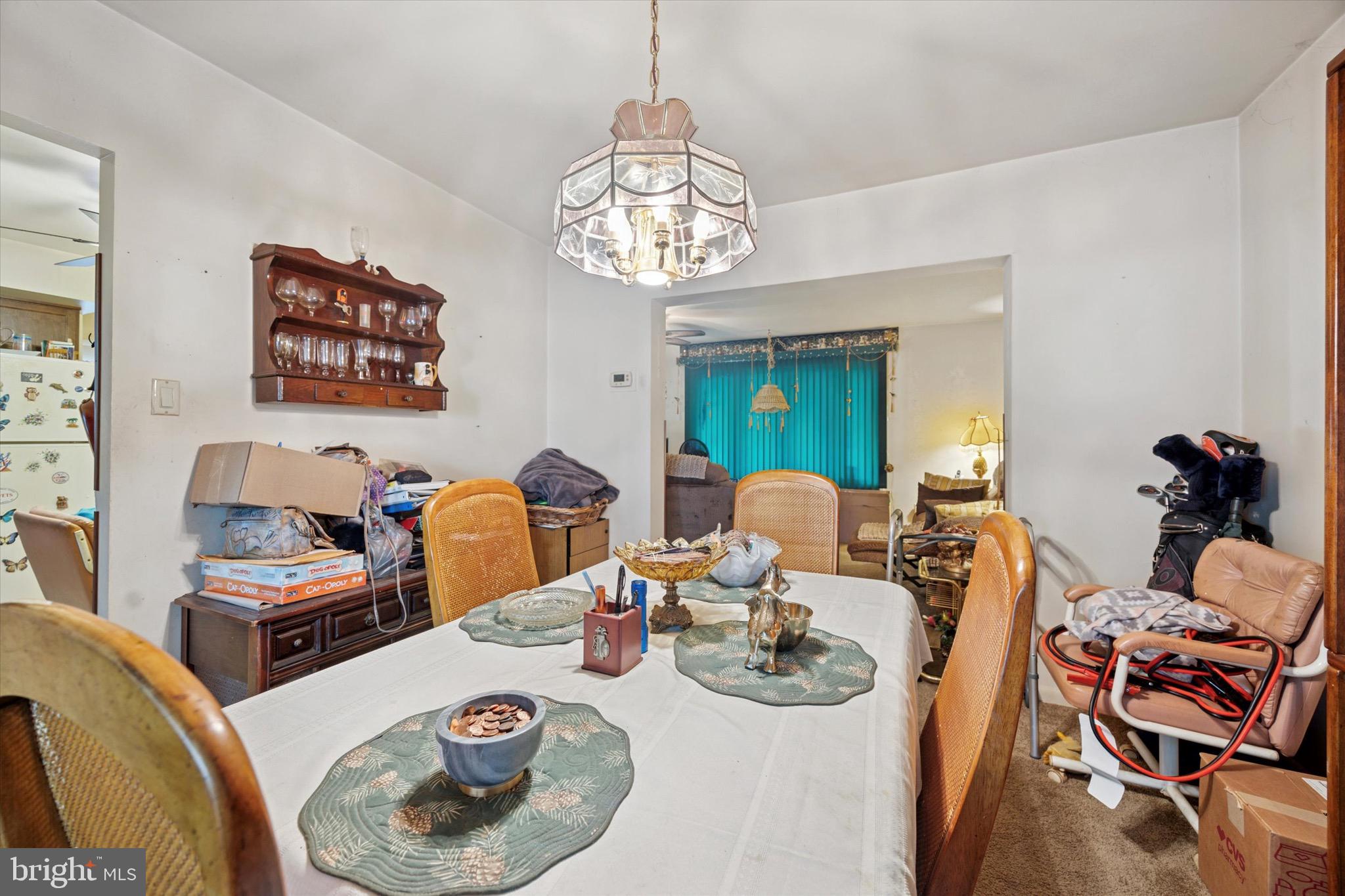 662 South Oak Avenue Secane, PA 19018 - Photo 11 of 39 a dining room with furniture a chandelier and wooden floor