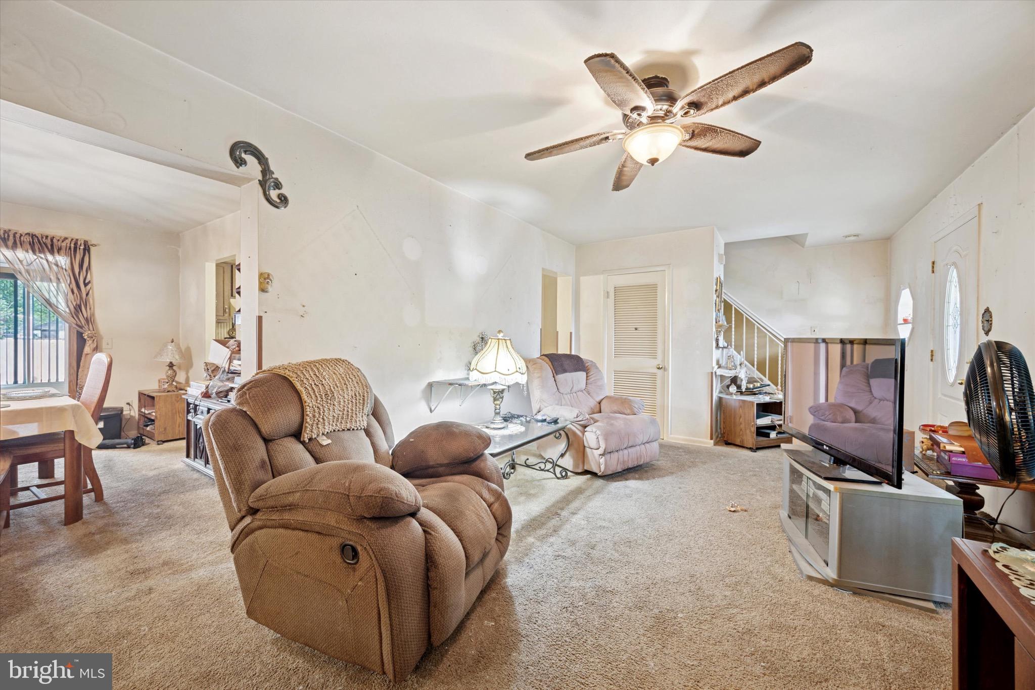 662 South Oak Avenue Secane, PA 19018 - Photo 5 of 39 a living room with furniture a ceiling fan and a window