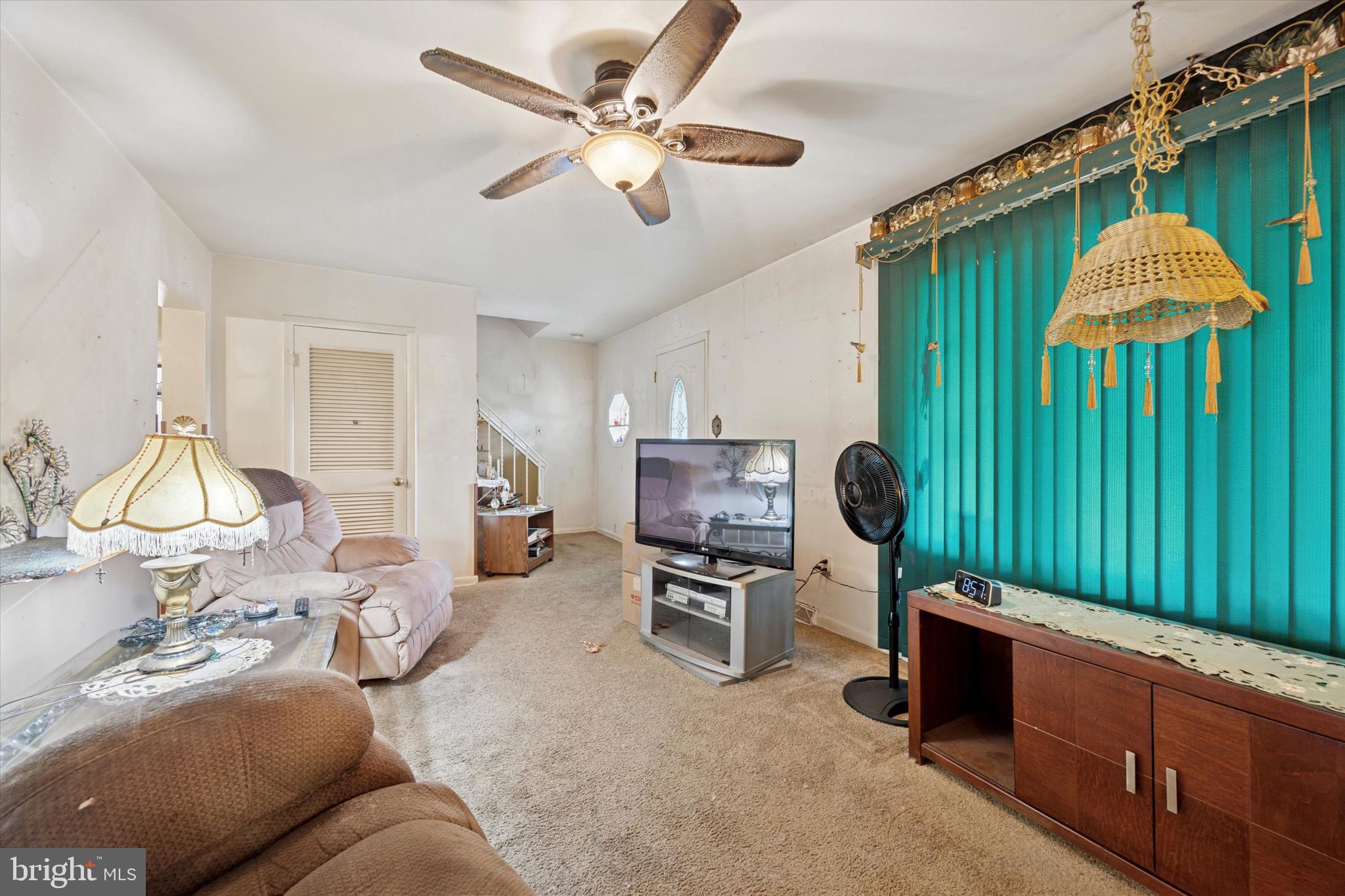 662 South Oak Avenue Secane, PA 19018 - Photo 6 of 39 a living room with furniture a chandelier fan and a window