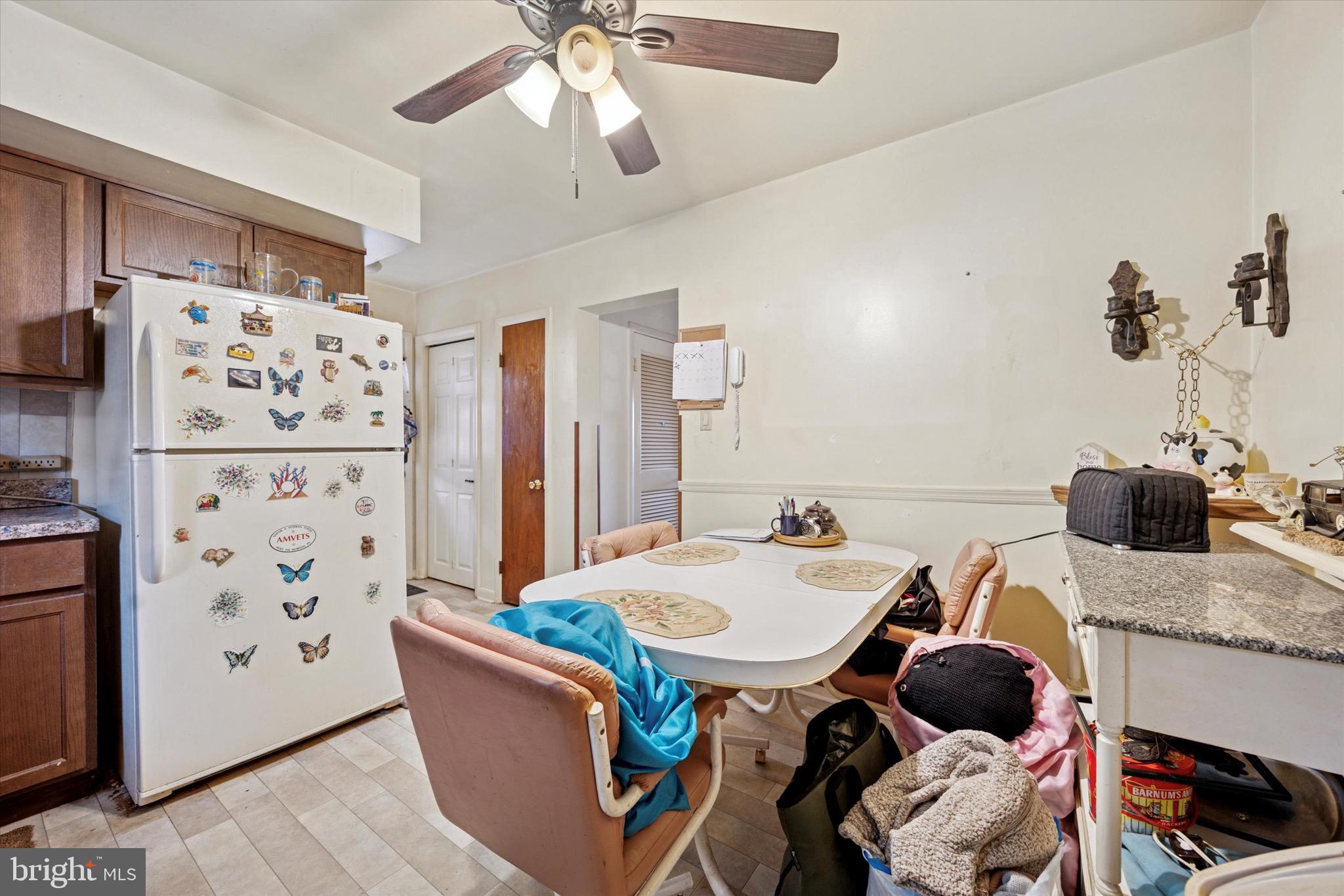 662 South Oak Avenue Secane, PA 19018 - Photo 8 of 39 a living room with furniture and a refrigerator
