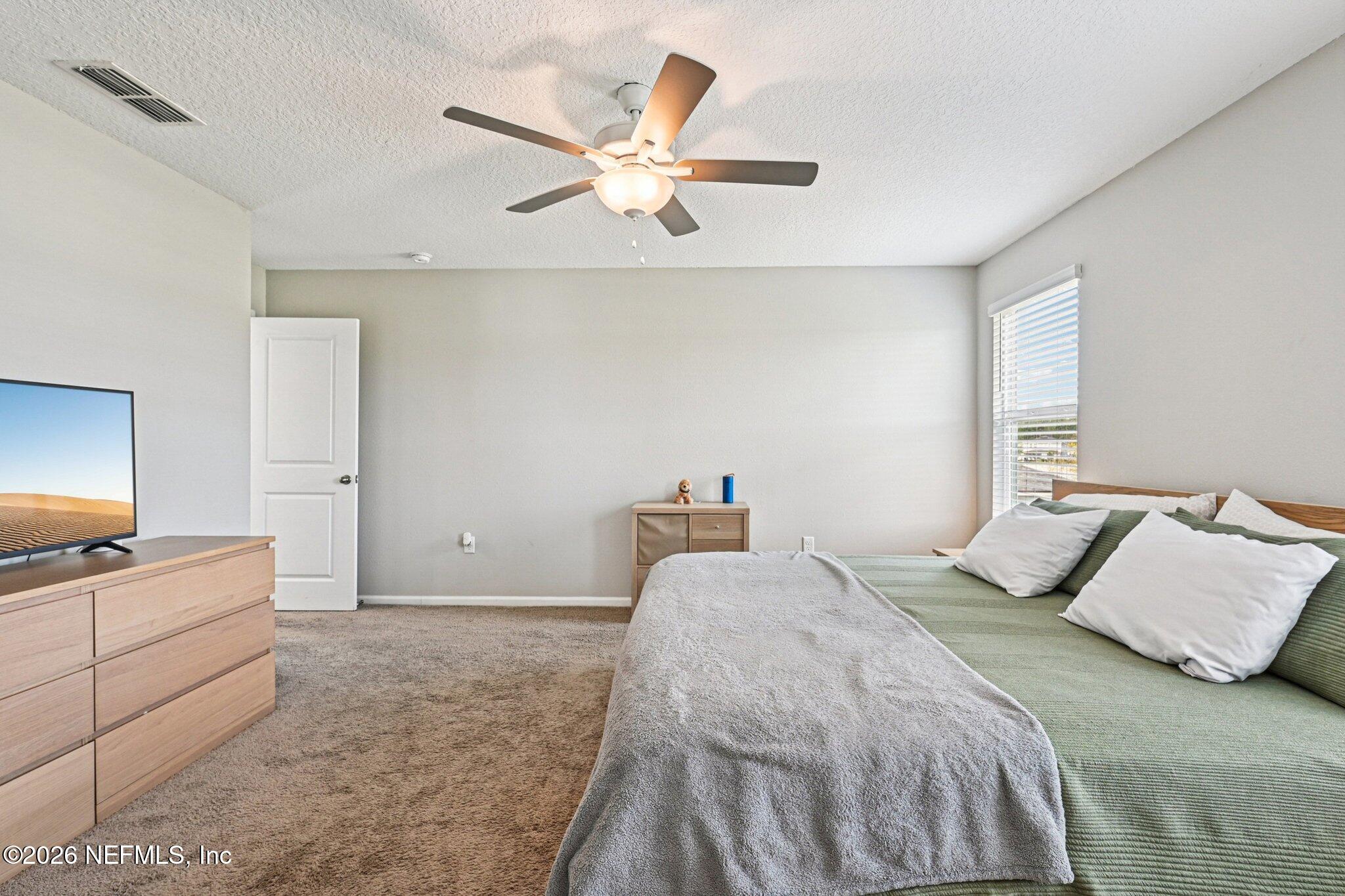 706 Meadow Ridge Drive St. Augustine, FL 32092 - Photo 25 of 67 Primary bedroom