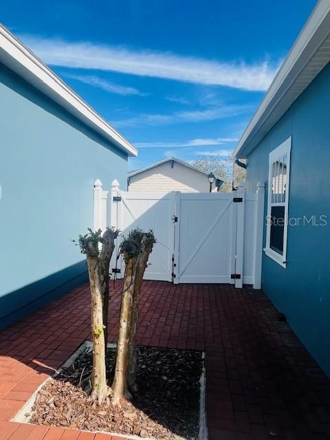 1268 Celebration Avenue Celebration, FL 34747 - Photo 17 of 25 a view of entryway and hall with wooden floor