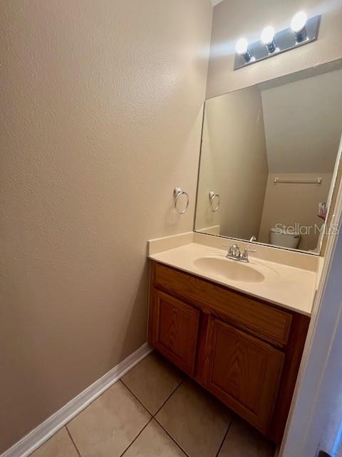 1268 Celebration Avenue Celebration, FL 34747 - Photo 23 of 25 a bathroom with a sink and a mirror