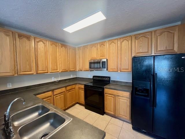 1268 Celebration Avenue Celebration, FL 34747 - Photo 25 of 25 a kitchen with a sink stove and refrigerator
