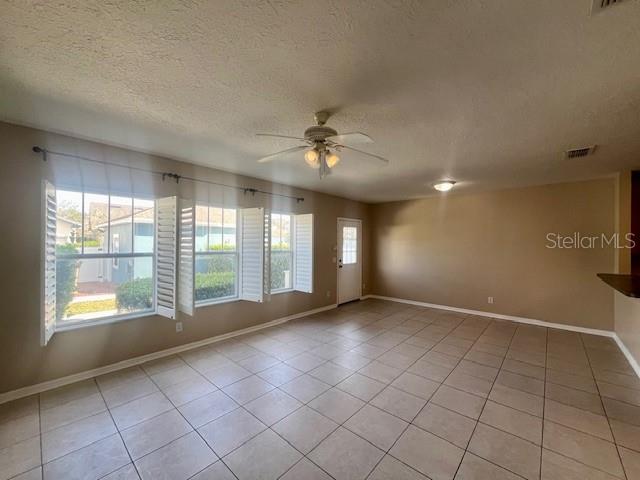 1268 Celebration Avenue Celebration, FL 34747 - Photo 4 of 25 a view of an empty room with a window