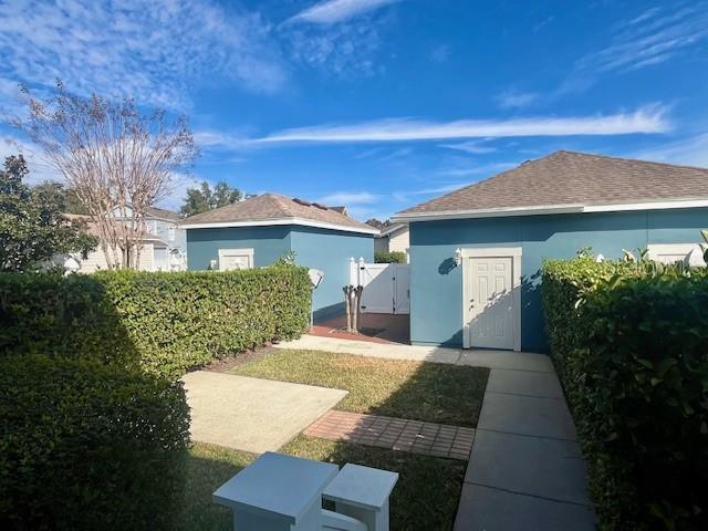 1268 Celebration Avenue Celebration, FL 34747 - Photo 6 of 25 a front view of a house with garden