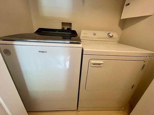 1268 Celebration Avenue Celebration, FL 34747 - Photo 7 of 25 a utility room with dryer and washer