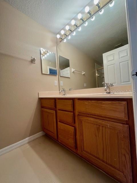 1268 Celebration Avenue Celebration, FL 34747 - Photo 9 of 25 a bathroom with a sink and a mirror