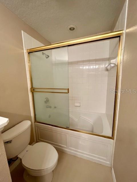 1268 Celebration Avenue Celebration, FL 34747 - Photo 10 of 25 a bathroom with a toilet and a shower